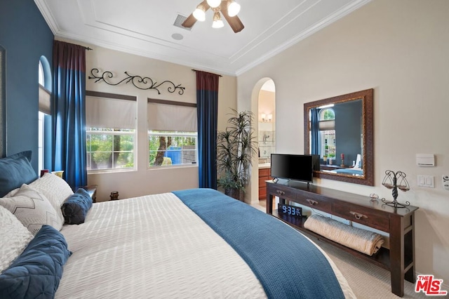 bedroom with ceiling fan and ornamental molding