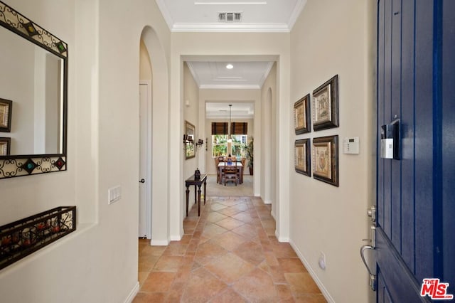 hallway featuring ornamental molding