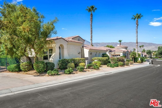 mediterranean / spanish home featuring a mountain view