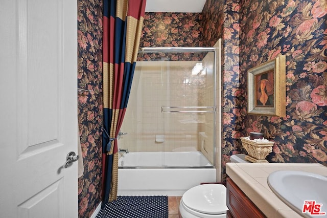 full bathroom featuring vanity, tile patterned flooring, toilet, and shower / bath combo