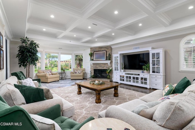 living room with beamed ceiling, wood-type flooring, coffered ceiling, and a fireplace