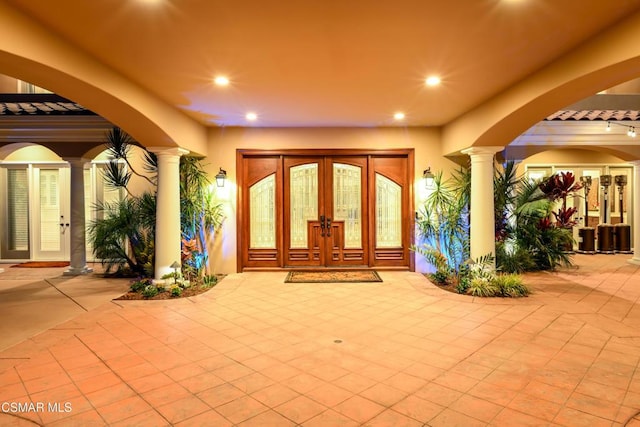 property entrance with french doors and a patio