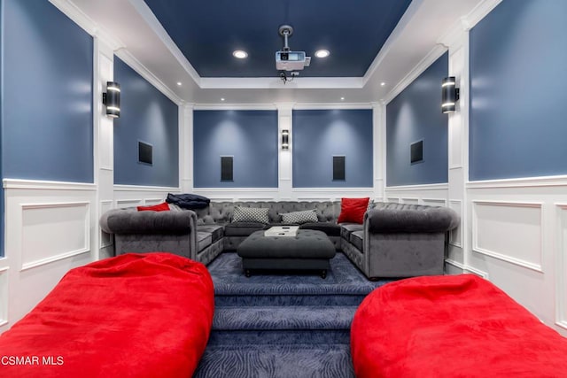 home theater featuring crown molding and a tray ceiling