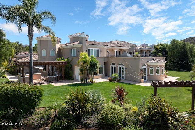 rear view of house featuring a patio, a balcony, an outdoor hangout area, a yard, and a pergola