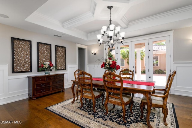 dining room with crown molding, coffered ceiling, dark wood-type flooring, and french doors