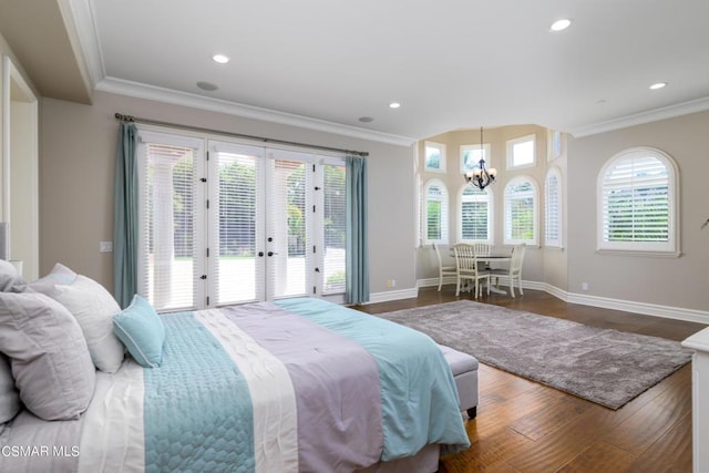 bedroom featuring an inviting chandelier, ornamental molding, access to exterior, and dark hardwood / wood-style flooring