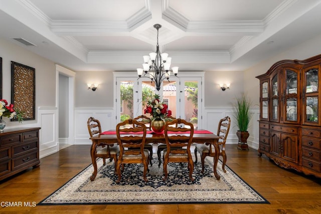 dining room featuring coffered ceiling, ornamental molding, and beamed ceiling