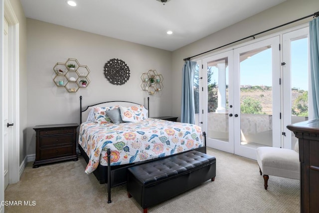 carpeted bedroom with access to outside and french doors