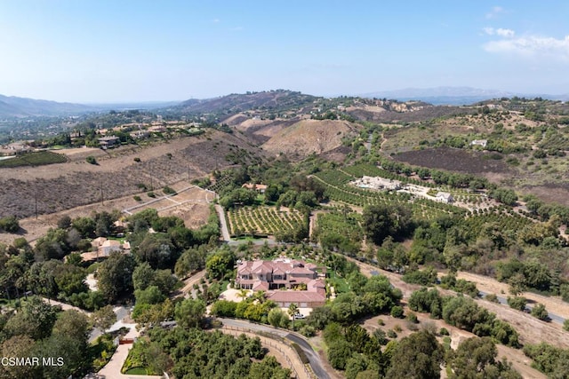 drone / aerial view with a mountain view and a rural view