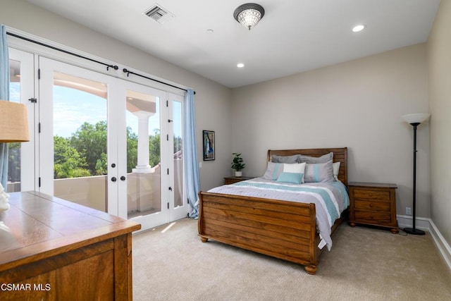 carpeted bedroom featuring french doors and access to outside