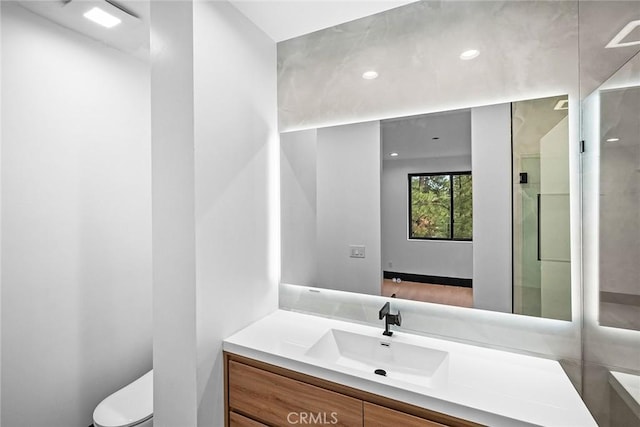 bathroom with vanity and toilet