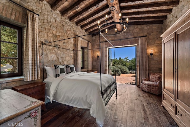 bedroom with a chandelier, beam ceiling, dark hardwood / wood-style flooring, and high vaulted ceiling