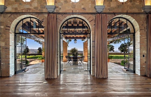 interior space featuring plenty of natural light and hardwood / wood-style floors