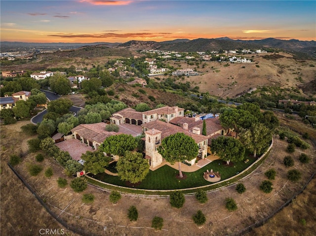 aerial view at dusk with a mountain view