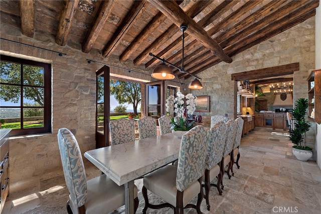 dining space featuring high vaulted ceiling, beamed ceiling, and wood ceiling