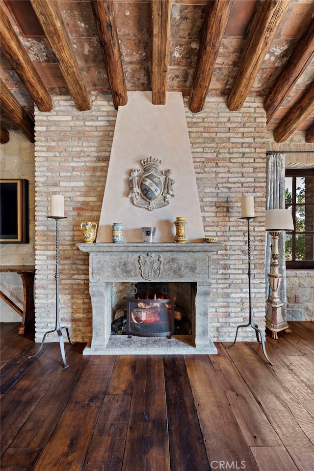 unfurnished living room with a high end fireplace, hardwood / wood-style floors, beamed ceiling, and wooden ceiling