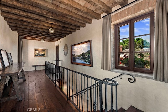 corridor with french doors, beamed ceiling, wood ceiling, and hardwood / wood-style floors