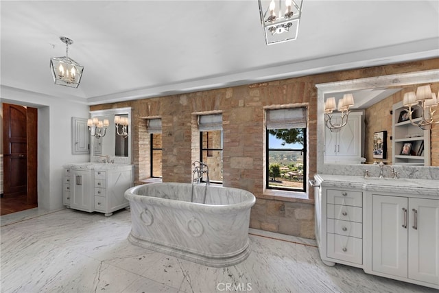 bathroom featuring vanity and a tub