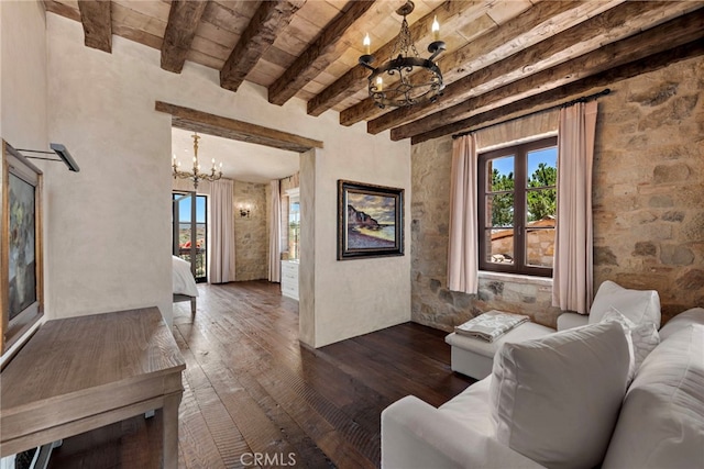 living room featuring a notable chandelier, dark hardwood / wood-style floors, beam ceiling, and wooden ceiling