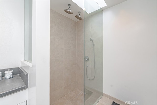 bathroom with tiled shower