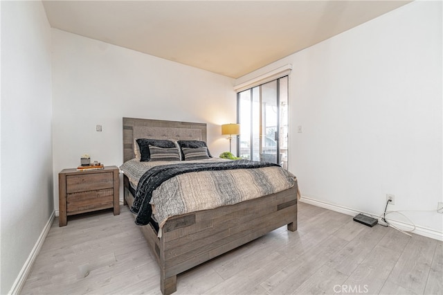 bedroom with light wood-type flooring