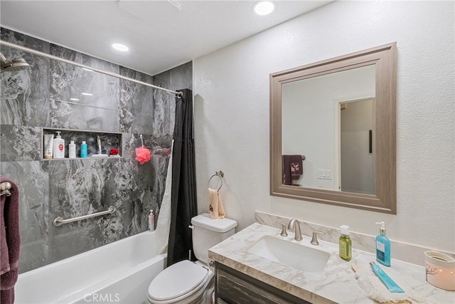 full bathroom featuring shower / bath combo with shower curtain, vanity, and toilet