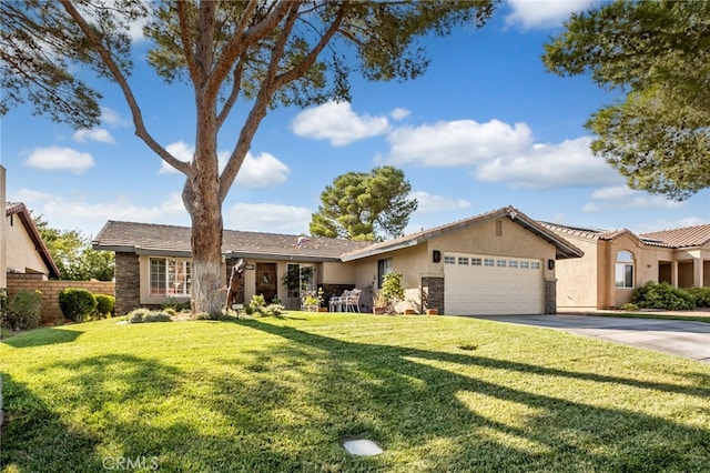 ranch-style house featuring a front lawn and a garage