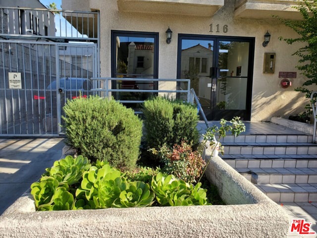 entrance to property featuring french doors