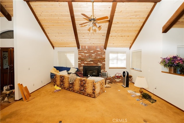 living room featuring ceiling fan, beamed ceiling, carpet, high vaulted ceiling, and a fireplace