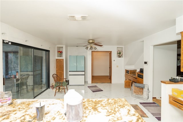 living room with ceiling fan