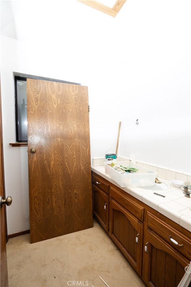 bathroom with vanity and ornamental molding