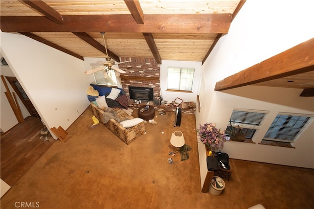 unfurnished living room with ceiling fan, a brick fireplace, wood-type flooring, lofted ceiling with beams, and wooden ceiling