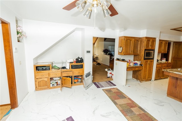 kitchen featuring ceiling fan