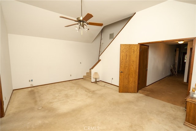 interior space featuring ceiling fan, light carpet, and high vaulted ceiling