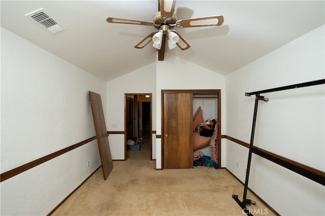 carpeted bedroom featuring vaulted ceiling, ceiling fan, and a closet