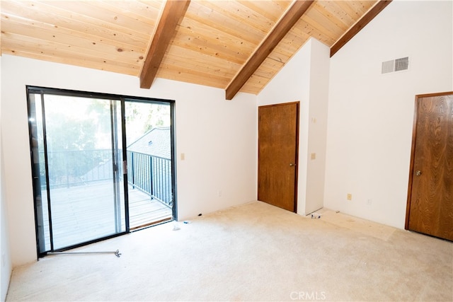 carpeted empty room featuring wooden ceiling and vaulted ceiling with beams