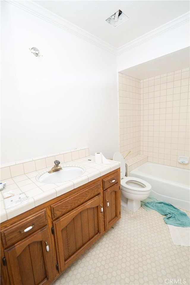 bathroom featuring crown molding, vanity, and toilet