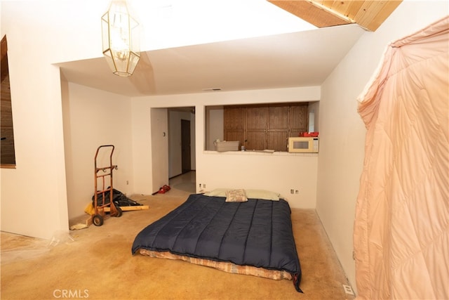 bedroom featuring light colored carpet