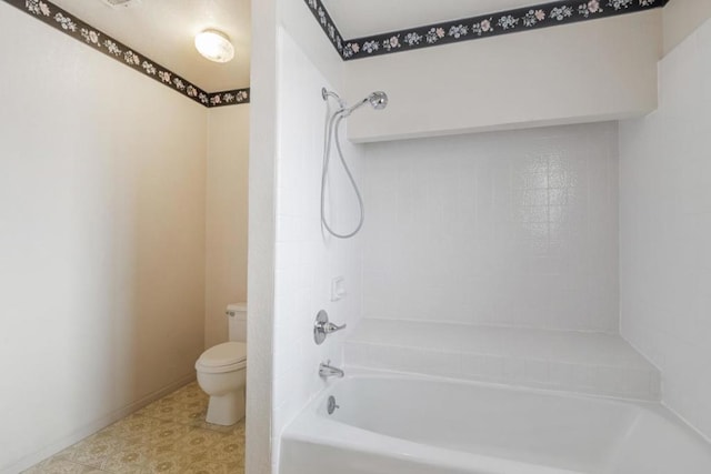 bathroom with washtub / shower combination and toilet