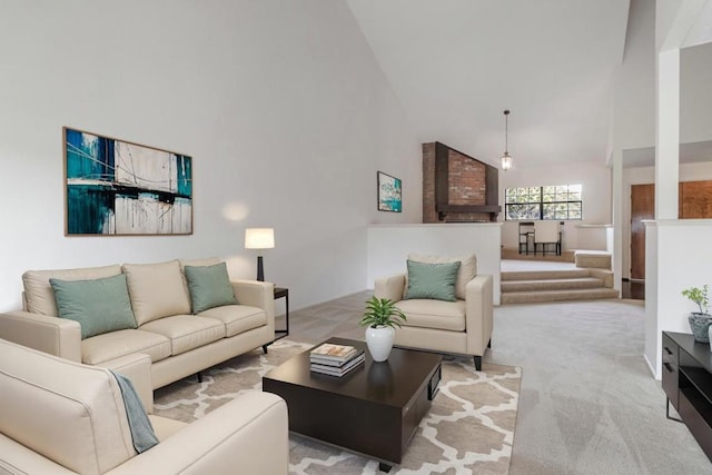 living room with light colored carpet and high vaulted ceiling