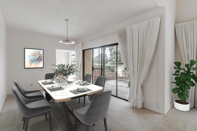 dining room featuring light colored carpet