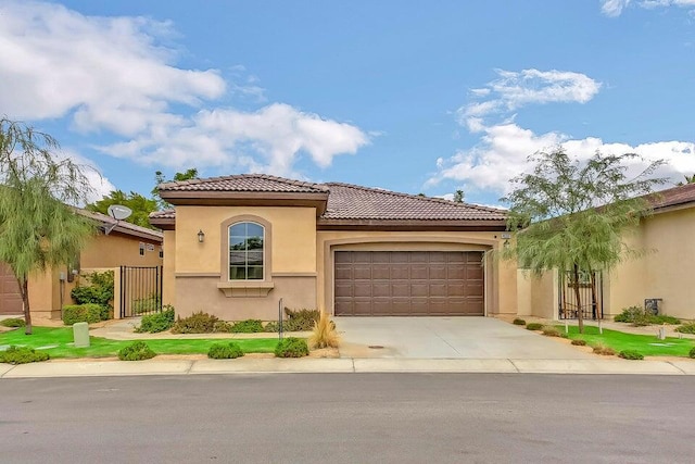 mediterranean / spanish-style house featuring a garage