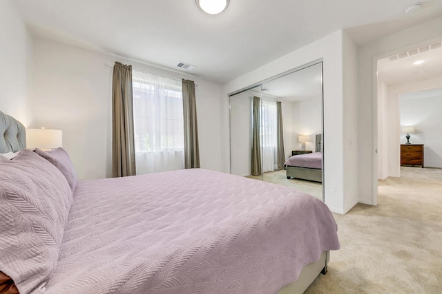 carpeted bedroom with a closet