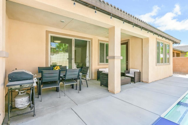 view of patio featuring an outdoor living space and a grill