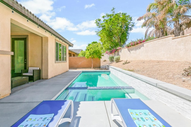 view of pool featuring a patio area