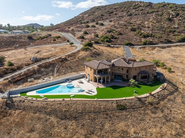 birds eye view of property featuring a mountain view