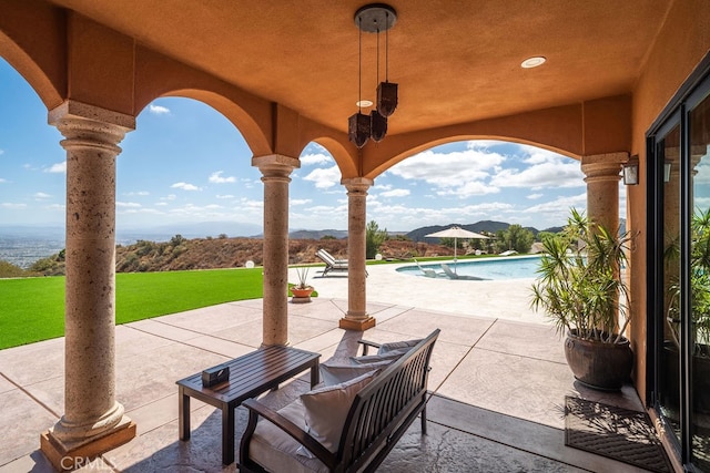 view of patio / terrace with a mountain view