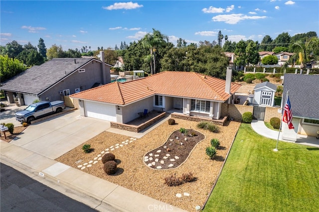 view of front of house featuring a garage and a front yard