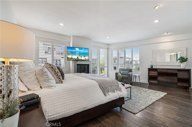 bedroom with dark wood-type flooring