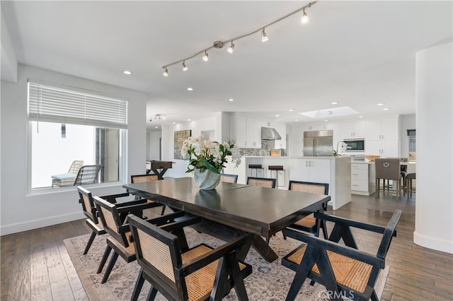 dining area featuring hardwood / wood-style flooring